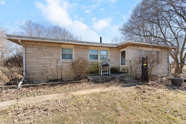 view of front of home with stone siding