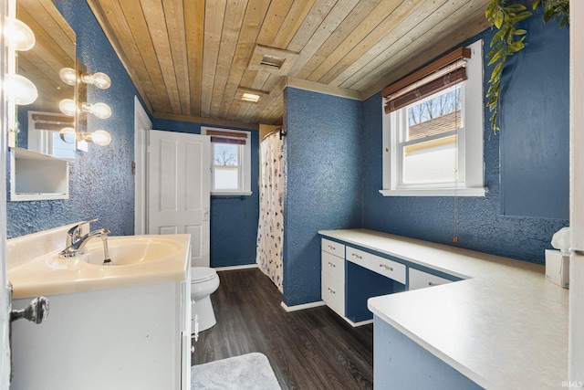 full bathroom featuring toilet, a textured wall, wooden ceiling, wood finished floors, and vanity