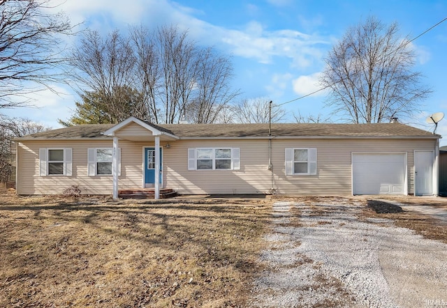 single story home featuring an attached garage and driveway