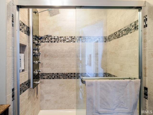 bathroom with a shower stall