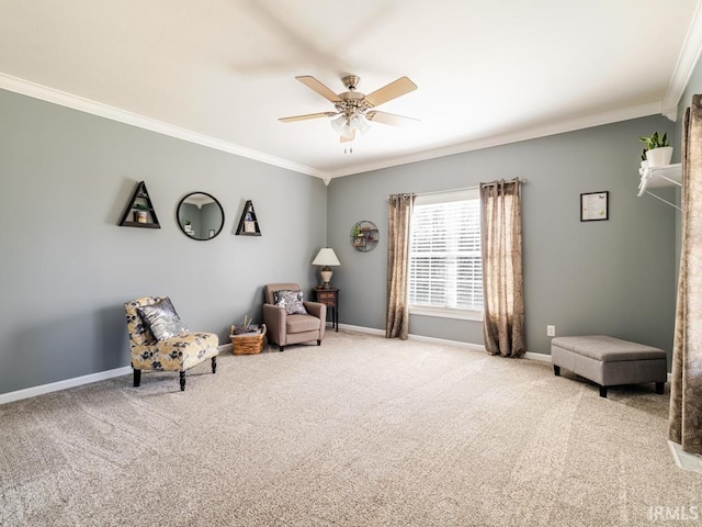 living area featuring ceiling fan, carpet flooring, baseboards, and ornamental molding