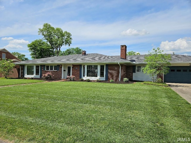 single story home with brick siding, a front yard, a chimney, a garage, and driveway