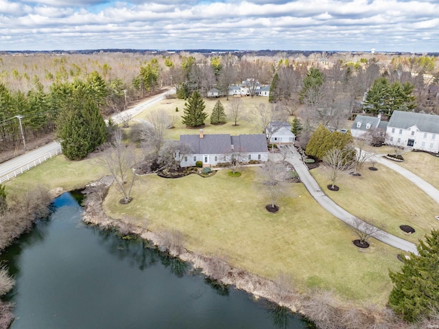 birds eye view of property featuring a view of trees