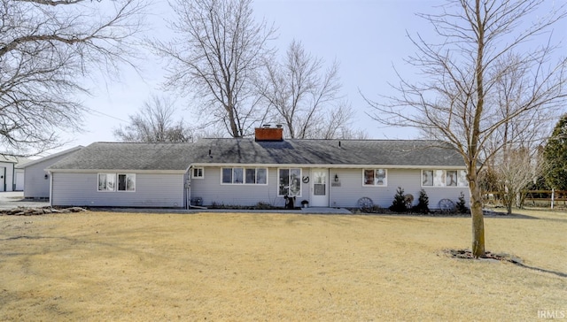 single story home featuring a front yard and a chimney