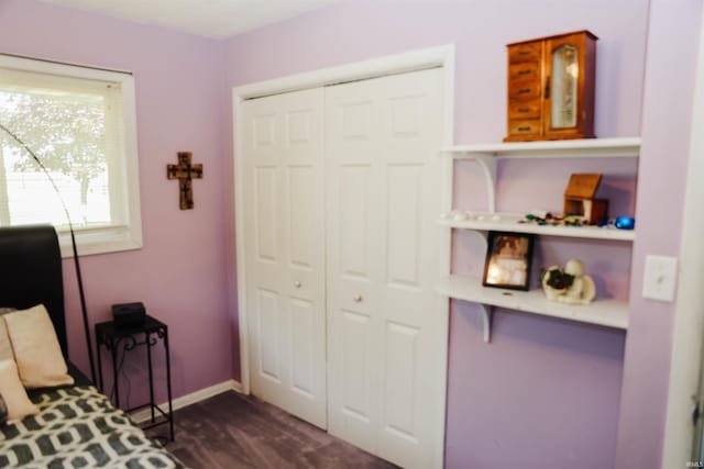 bedroom featuring a closet and baseboards