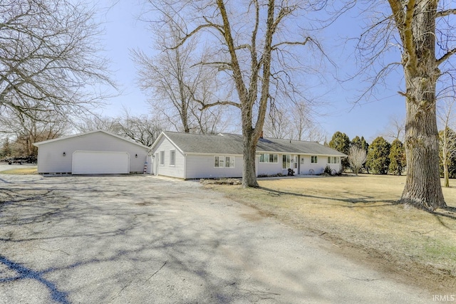 view of front of house featuring a garage and an outdoor structure