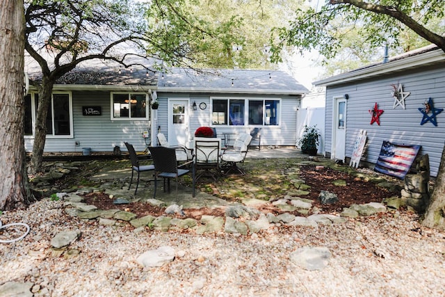 rear view of property featuring a patio area