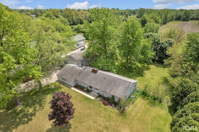 view from above of property with a heavily wooded area