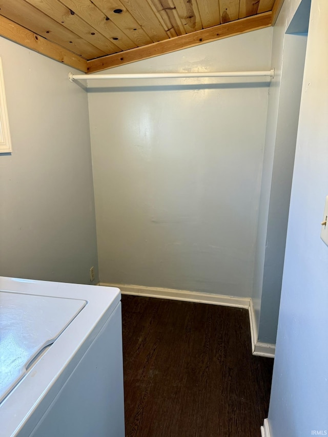 washroom with baseboards, washer / clothes dryer, wooden ceiling, and dark wood-style flooring