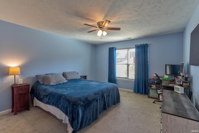 bedroom with ceiling fan, visible vents, baseboards, and light carpet