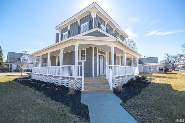 farmhouse-style home with a porch and a front yard