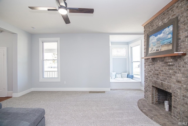 living area with visible vents, carpet, baseboards, a brick fireplace, and ceiling fan