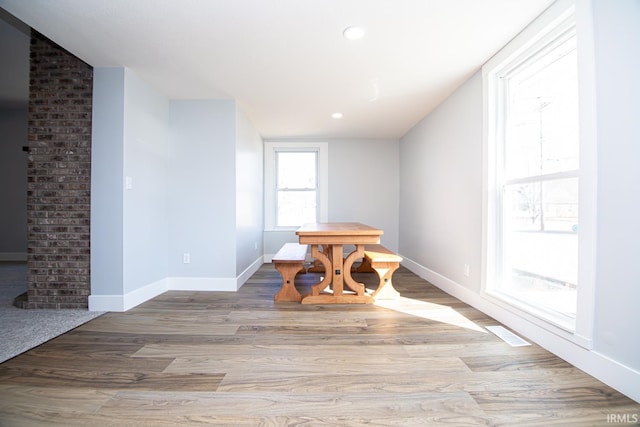 unfurnished dining area featuring light wood finished floors, recessed lighting, and baseboards