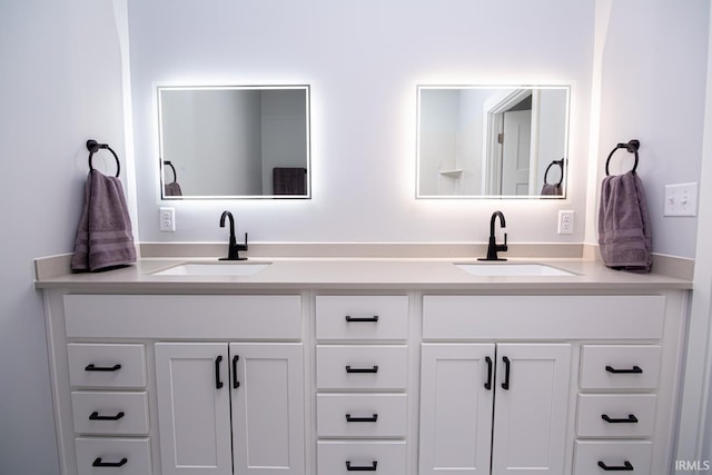 bathroom featuring double vanity and a sink