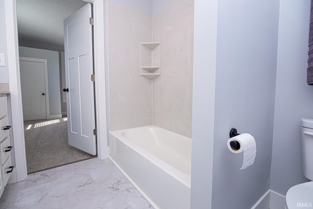 bathroom with  shower combination, toilet, baseboards, and marble finish floor