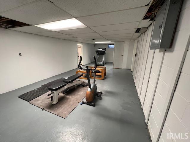 exercise area with a paneled ceiling