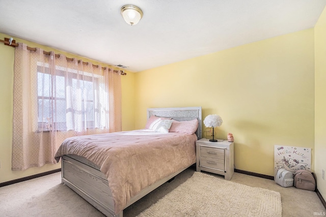 bedroom with visible vents, baseboards, and carpet floors