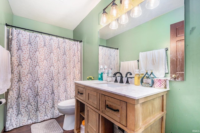 full bath featuring vanity, toilet, and wood finished floors