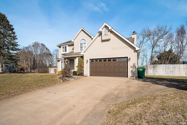 traditional-style home with a front yard, fence, a chimney, concrete driveway, and a garage