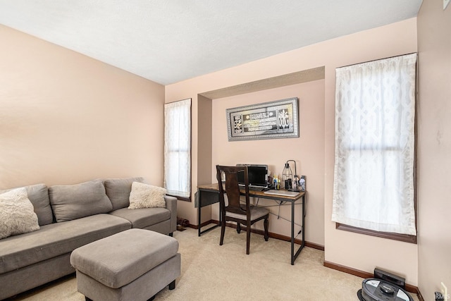 office area with baseboards and light colored carpet