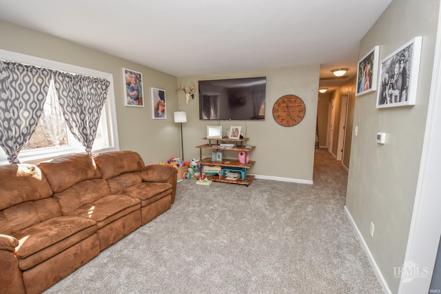 living room with baseboards and carpet flooring