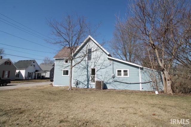 exterior space with a yard and central AC unit