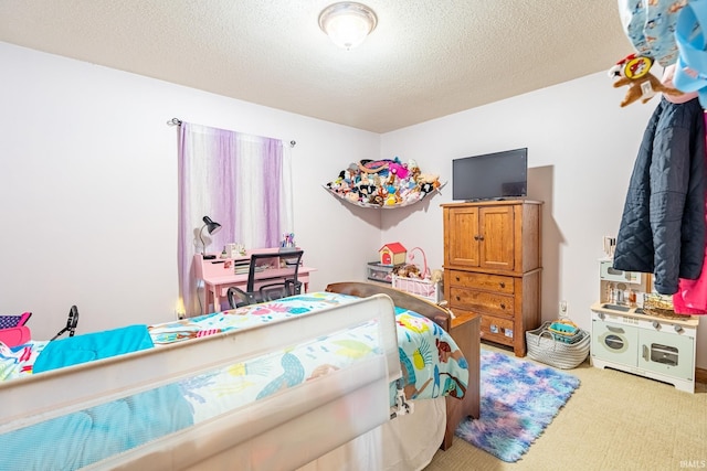 bedroom featuring light colored carpet and a textured ceiling