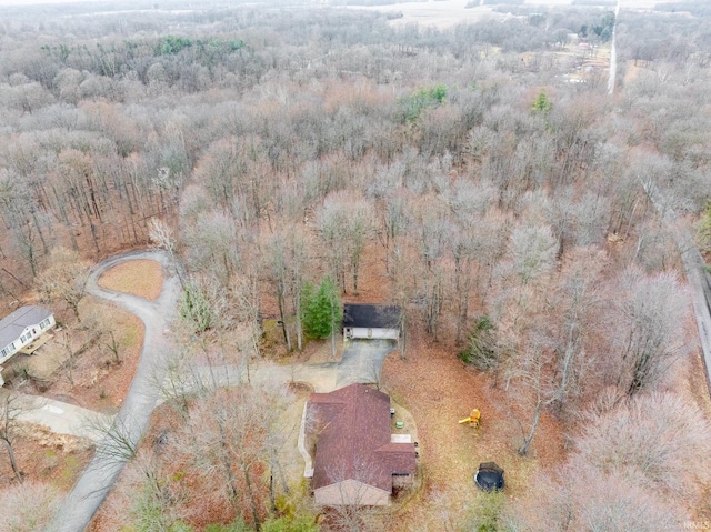 drone / aerial view featuring a forest view