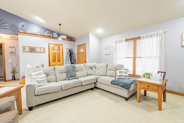 living area with light carpet, baseboards, and vaulted ceiling