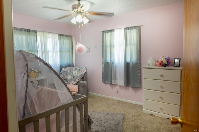 bedroom with carpet flooring, a ceiling fan, and baseboards