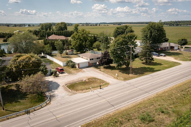 birds eye view of property with a rural view