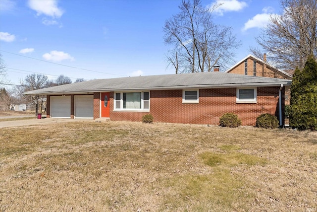 ranch-style home with a front lawn, concrete driveway, an attached garage, brick siding, and a chimney