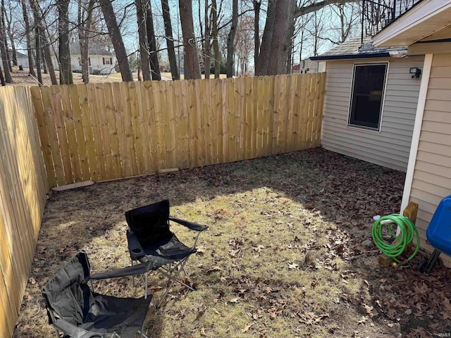 view of yard with a fenced backyard