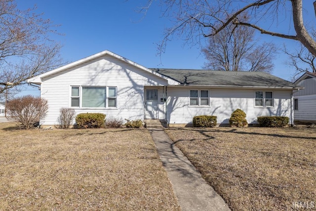 ranch-style house featuring a front lawn