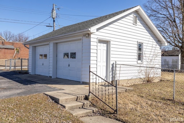 detached garage with fence