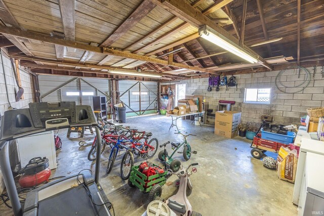 garage with concrete block wall