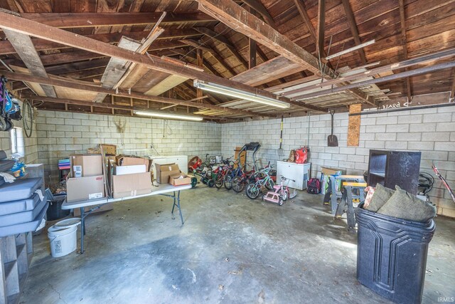 garage featuring concrete block wall