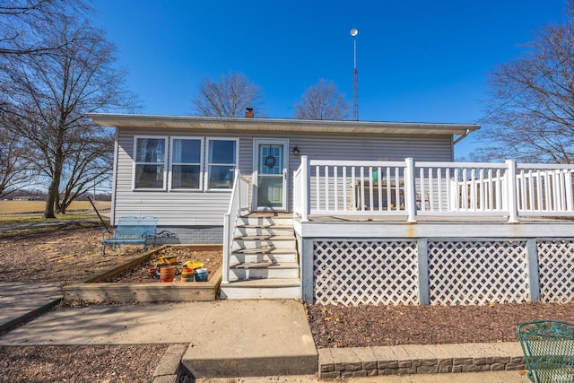 view of front of property with a wooden deck