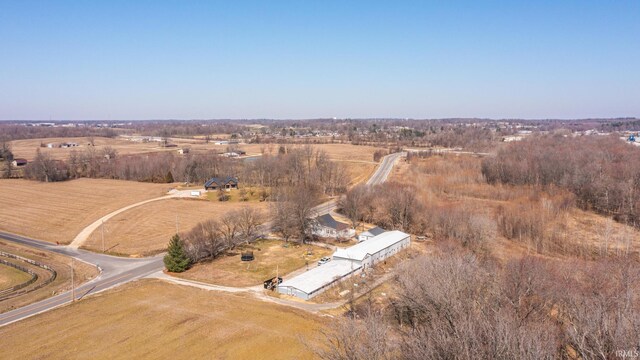 birds eye view of property featuring a rural view