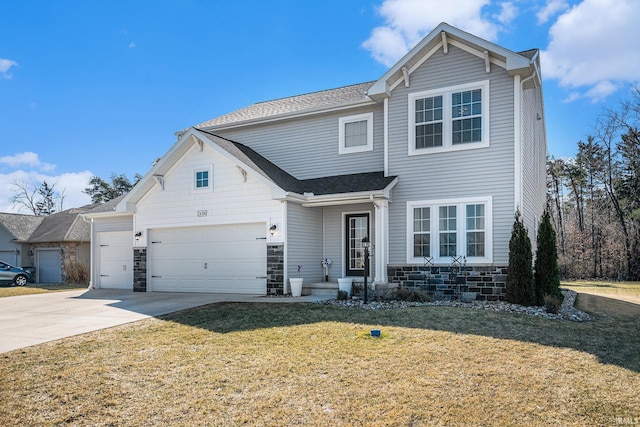 traditional-style home with stone siding, driveway, an attached garage, and a front lawn