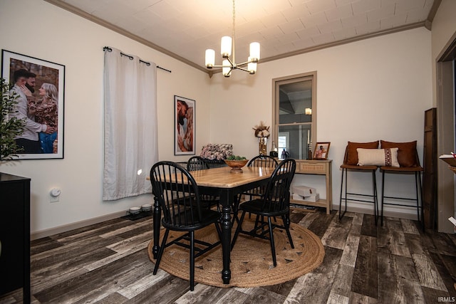 dining room with a chandelier, wood finished floors, and ornamental molding