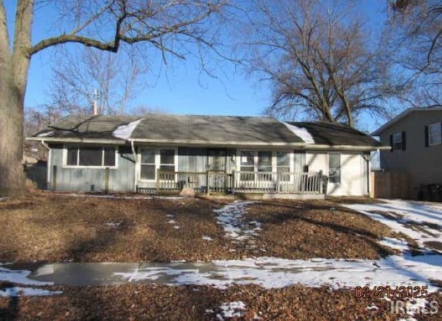 ranch-style home featuring covered porch