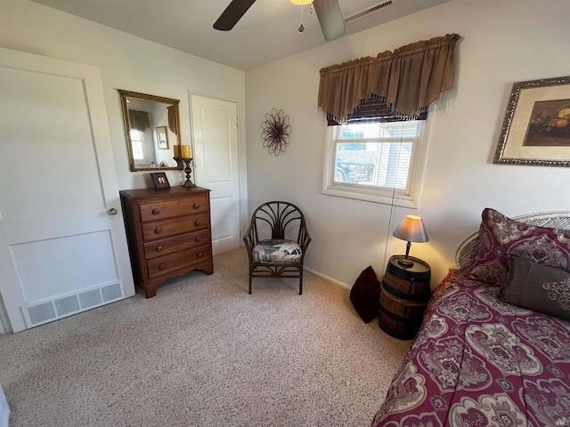 bedroom featuring a ceiling fan, visible vents, and carpet floors