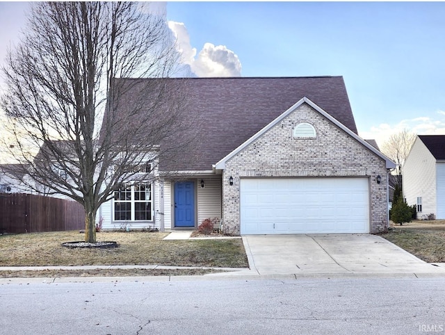 view of front facade featuring a garage, brick siding, driveway, and fence