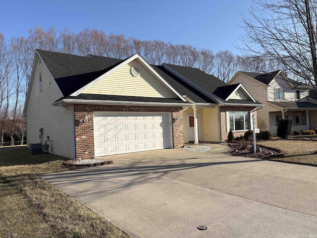 ranch-style home with driveway, brick siding, and an attached garage