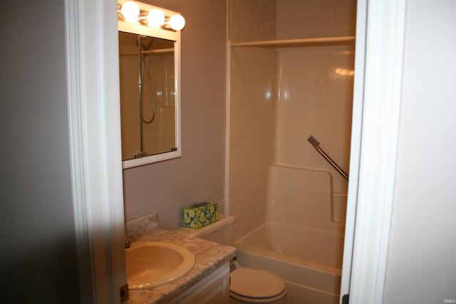 full bath featuring vanity, toilet, and bathtub / shower combination