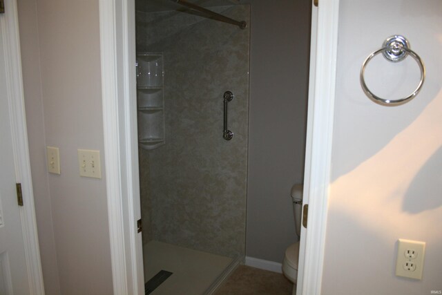 full bath with a shower stall and toilet