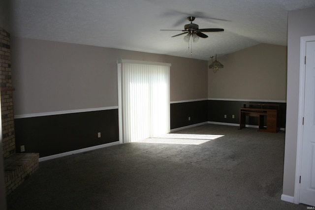 unfurnished living room with carpet, lofted ceiling, a ceiling fan, and baseboards