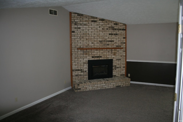 unfurnished living room with visible vents, carpet floors, a textured ceiling, and vaulted ceiling