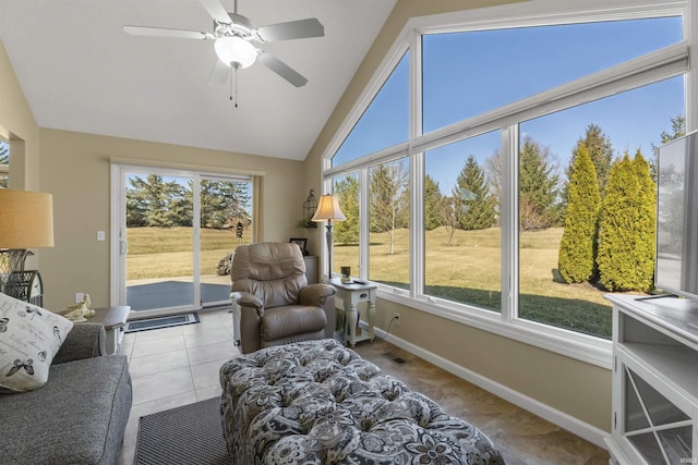 sunroom / solarium with visible vents, a healthy amount of sunlight, a ceiling fan, and vaulted ceiling